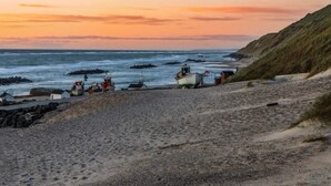 A coastal scene with boats and a rocky shoreline. - 6 Person Holiday Home in Hjorring (Hjørring)