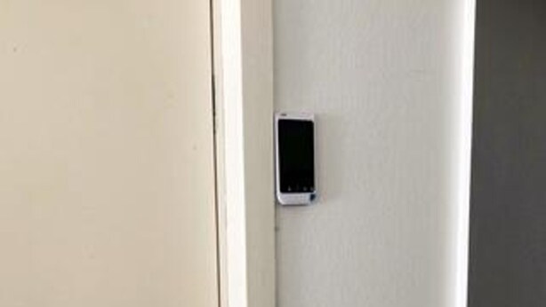 A door with a small, rectangular object mounted on it, possibly a security device or intercom. - 6 Person Holiday Home in Ebeltoft (Ebeltoft)
