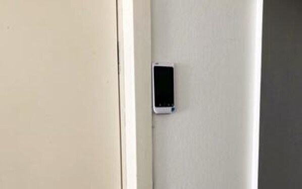 A door with a small, rectangular object mounted on it, possibly a security device or intercom. - 6 Person Holiday Home in Ebeltoft (Ebeltoft)