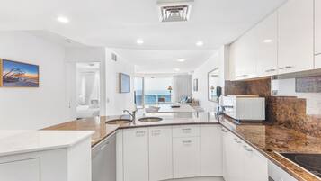 Panoramic Apartment | Private kitchen | Full-size fridge, microwave, oven, stovetop