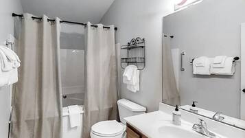 Jetted tub, hair dryer, towels, toilet paper