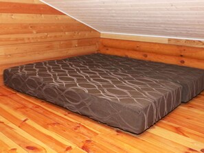 A wooden interior with a mattress on the floor. - 4 Star Holiday Home in Hadsund (Hadsund)
