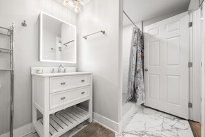 Shower, hair dryer, towels, soap