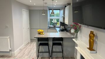 Junior Apartment | Private kitchen | Full-size fridge, oven, stovetop, electric kettle