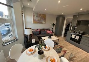 Classic Apartment | Living area | 55-inch Smart TV with satellite channels, TV