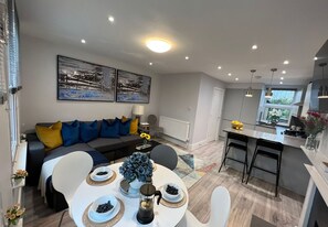 Comfort Apartment | Living area | 55-inch Smart TV with satellite channels, TV