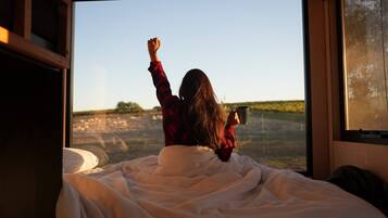 Premium bedding, individually furnished, blackout curtains