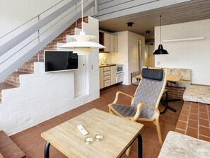 A modern interior with a dining area, kitchen, and seating space. - 6 Person Holiday Home in Brovst (Brovst)