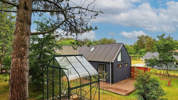 A modern house with a large greenhouse structure. - 6 Person Holiday Home in Hals-by Traum (Hals)