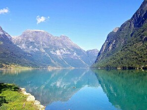 A calm lake surrounded by mountains. - 4 Person Holiday Home in Oldedalen (Stryn)