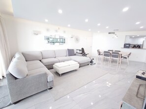 Deluxe Condo, 3 Bedrooms, Non Smoking, Ocean View | Living area | 55-inch Smart TV with cable channels, TV - Alupang Beach Tower, UPGRADED units (Tamuning)