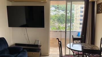 Comfort Quadruple Room, 1 King Bed, Non Smoking, Ocean View | Living area | Smart TV