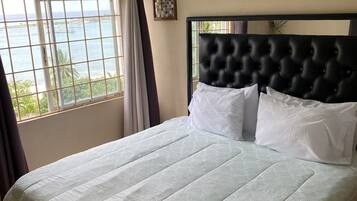 Comfort Quadruple Room, 1 King Bed, Non Smoking, Ocean View | Iron/ironing board, free WiFi, bed sheets
