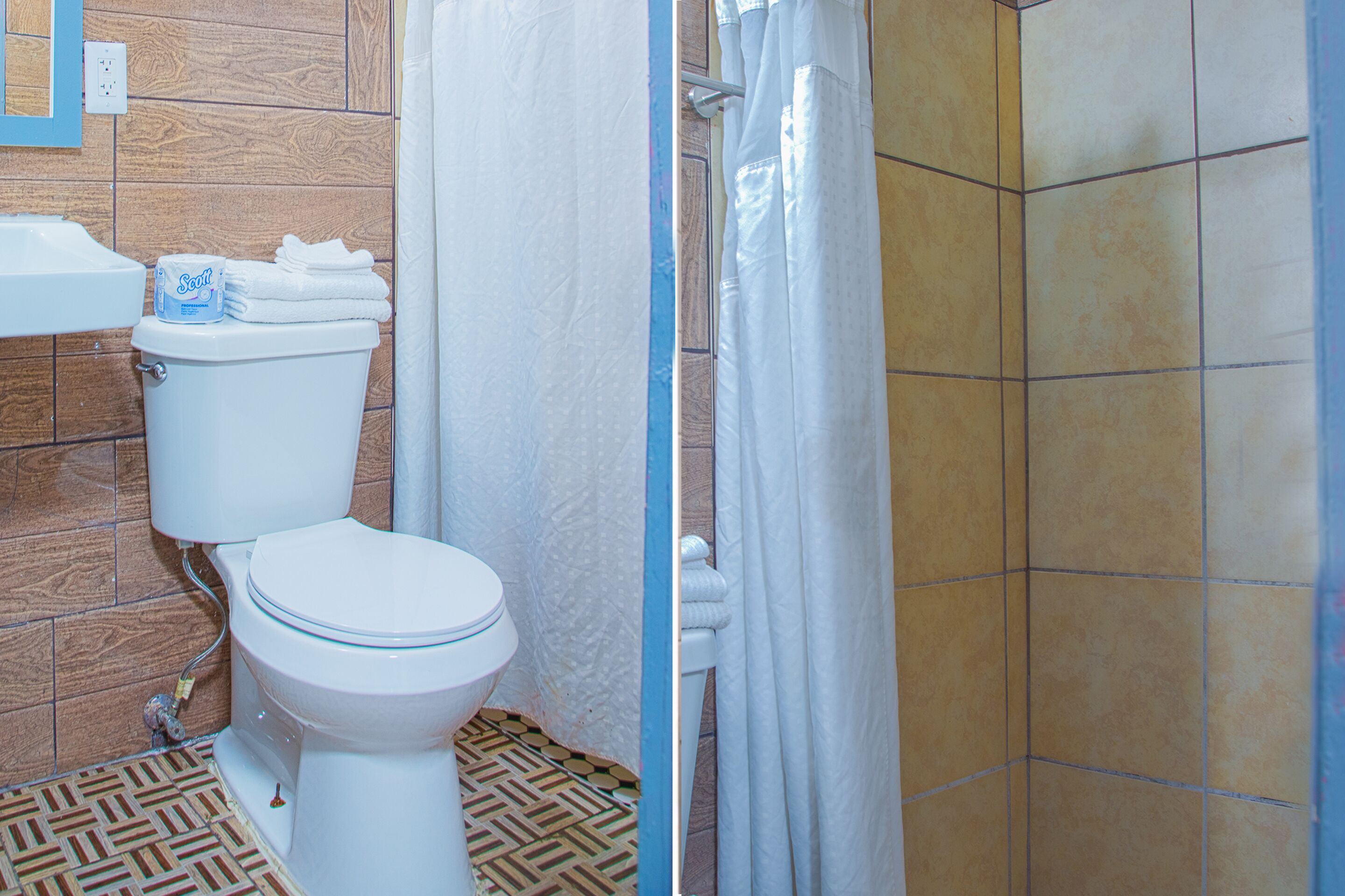A bathroom with a toilet, a sink, and a shower curtain.