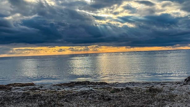 A beach with a view of the ocean and a cloudy sky. - 10 Person Holiday Home in Dragor (Dragor)