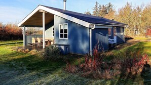 A single-story house with a sloped roof, a covered porch, and a chimney. - 5 Person Holiday Home in Hals (Hals)