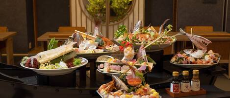 A seafood buffet with various dishes and condiments.