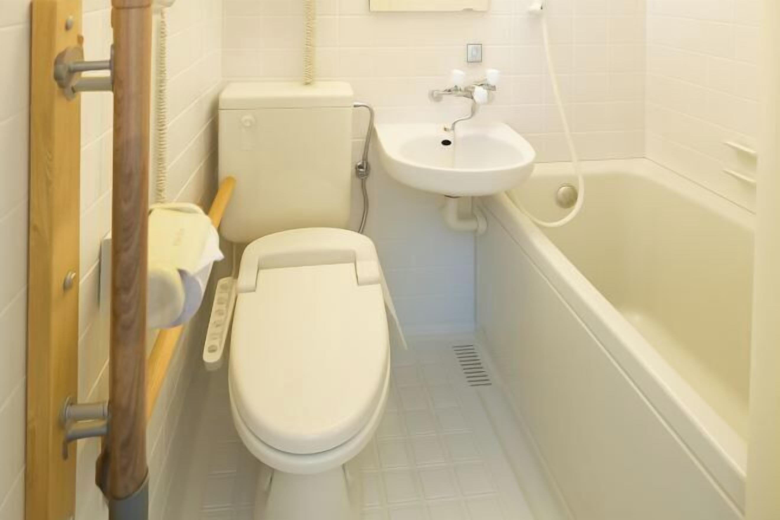 Bathroom | Separate bathtub and shower, hair dryer, slippers, towels