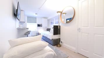 1 bedroom, desk, iron/ironing board, travel crib