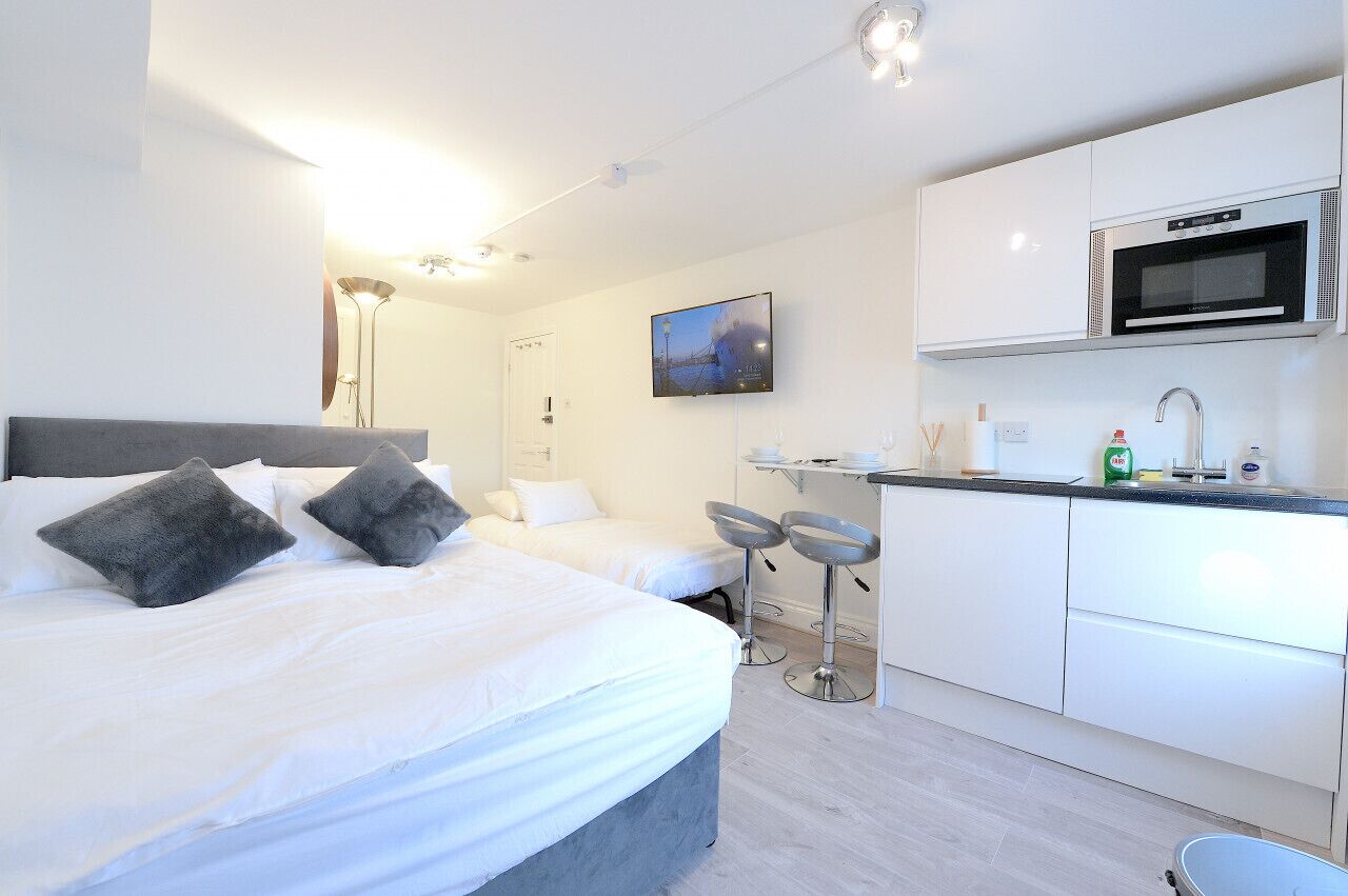 1 bedroom, desk, iron/ironing board, travel crib