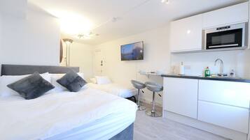 1 bedroom, desk, iron/ironing board, travel crib
