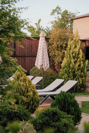 Seasonal outdoor pool, pool loungers