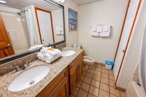 A bathroom with two sinks, a large mirror, a toilet, and a shower. - Steps from Beach, Direct View, Oceanfront Paradise (North Myrtle Beach)