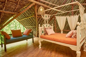 Deluxe Studio, Pool View, Tower | Living area | Books - Lions Luxury Eco-Resort & Spa (Malindi)