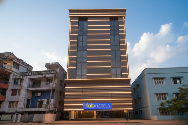 A modern building with a prominent 'fabHOTELS' sign at the entrance.