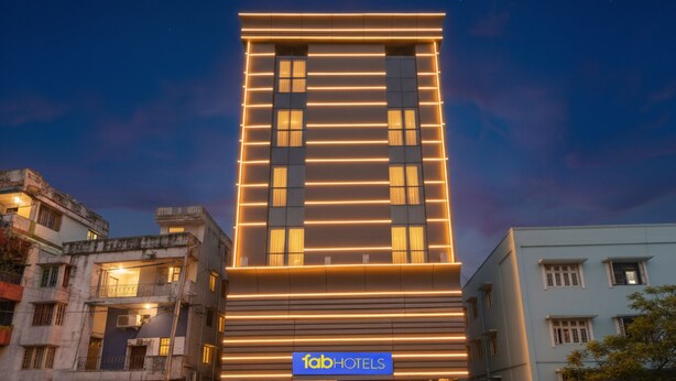 A modern hotel building with a prominent 'Tab Hotels' sign, featuring a clean, contemporary design with horizontal lighting accents. - Fabhotel Eros 211 (Bidhannagar)