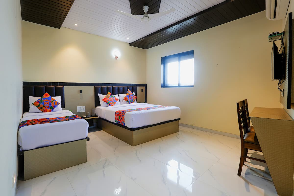 Habitación familiar | Sábanas de algodón egipcio y ropa de cama de alta calidad