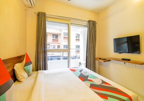Egyptian cotton sheets, premium bedding, in-room safe, desk - FabHotel Habitat (Pune)