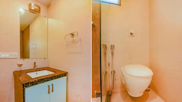 Habitación Deluxe | Baño | Regadera, regadera tipo lluvia, amenidades de baño gratuitas, toallas