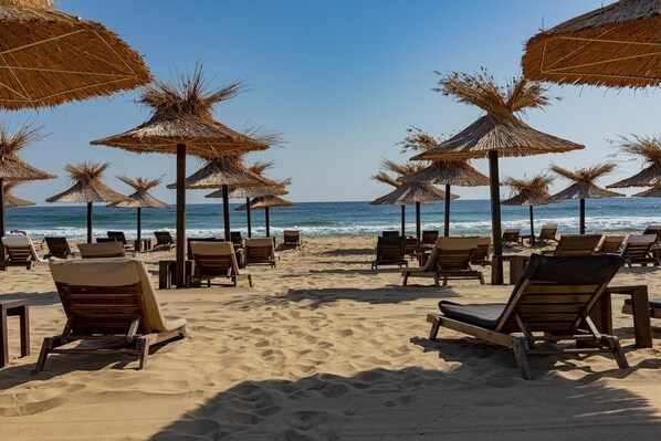 Beach nearby, sun loungers