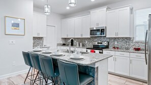 Microwave, oven, stovetop, dishwasher - Rent This Luxury 5 Star House on Storey Lake Resort, Orlando House 6163 (Kissimmee)