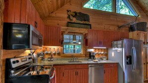 Unclassified image, 5 of 28, button - Laughing Waters- nestled along Fighting Town Creek, offering pet-friendly bliss with a hot tub, firepit, larege screened porch and excellent fishing. WiFi (Cherry Log)