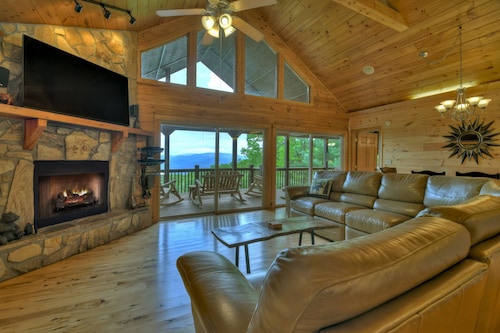 Hummingbird Haven is the ultimate retreat for large groups! Enjoy pet-friendly accommodations, breathtaking mountain views, a hot tub, firepit, WiFi, and hiking