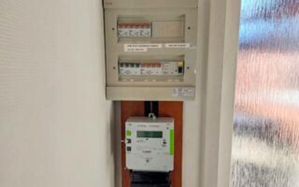 An electrical panel with meters and switches, likely for utility management.
