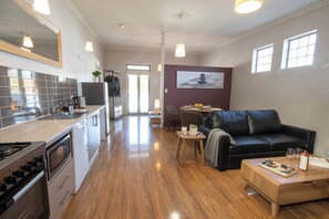 Executive Apartment | Living area | 54-inch Smart TV with digital channels - Lithgow Apartments (Lithgow)