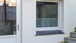 A white building with a window and a door. - 2 Person Holiday Home in Grasten (Grasten)