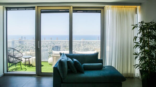 Apartment, 3 Bedrooms | Living area | 65-inch flat-screen TV with cable channels - YalaRent Midtown towers TLV (Tel Aviv)