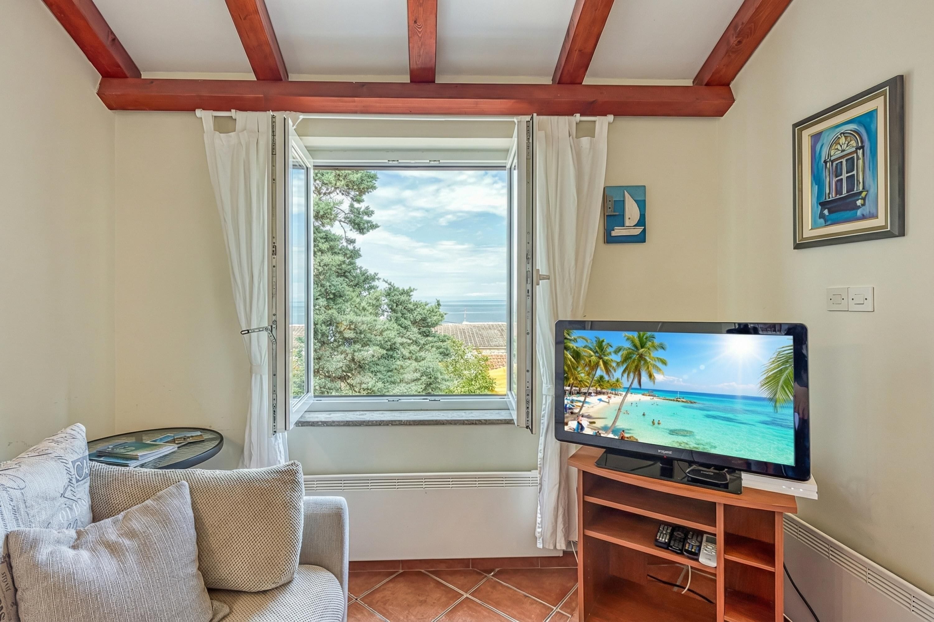 Family Apartment, Multiple Bedrooms (Valdarke Sea View Apartment) | Living area | 21-inch flat-screen TV with satellite channels, TV