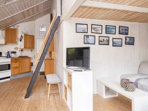 A compact living space with a kitchen, a dining area, and a seating area with a TV. - 5 Person Holiday Home in Hovborg (Hovborg)
