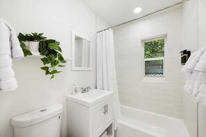 Bathtub, hair dryer, towels