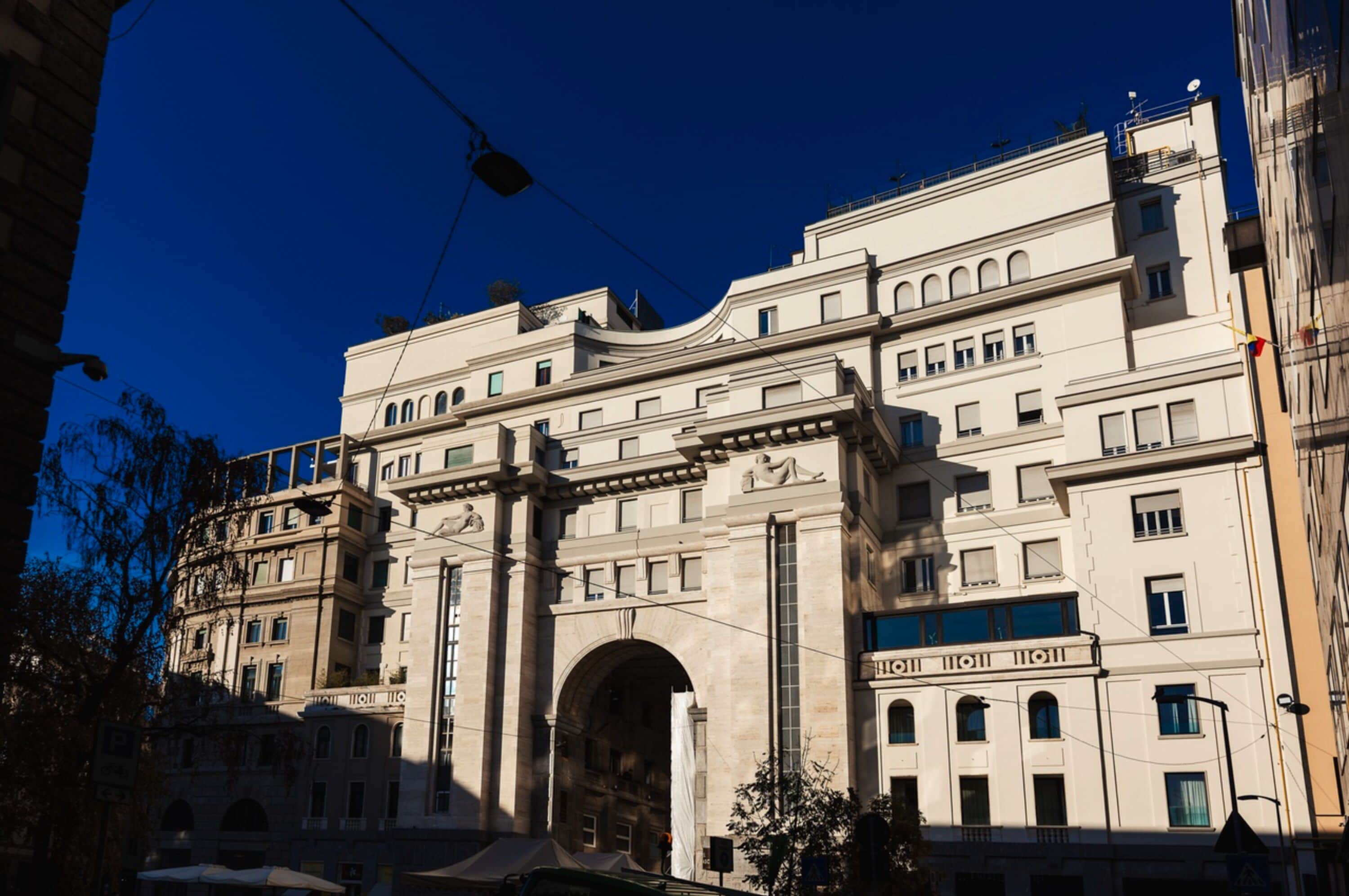 A historic building with classical architecture, featuring multiple arches and columns, and a prominent entrance.