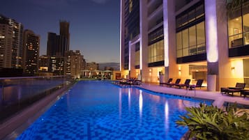 Outdoor pool, open 7:00 AM to 10:00 PM, free pool cabanas
