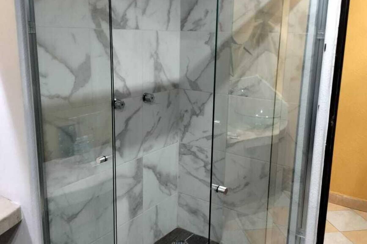 basic double room | bathroom | shower, towels, soap, shampoo