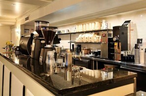 Enjoy freshly brewed coffee at our in-hotel coffee bar, featuring a large espresso machine and a selection of specialty coffee.