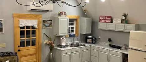 Fridge, microwave, stovetop, coffee/tea maker