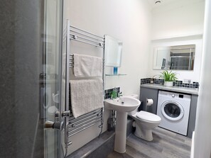 Shower, hair dryer, towels, soap